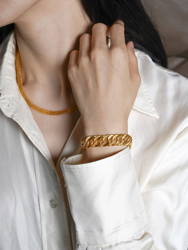 Women wearing 916 Gold Distinct Lipan Bracelet