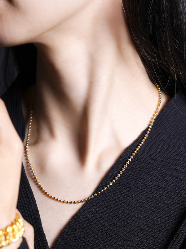 A women wearing a 916 Gold Two Tone Beads Necklace