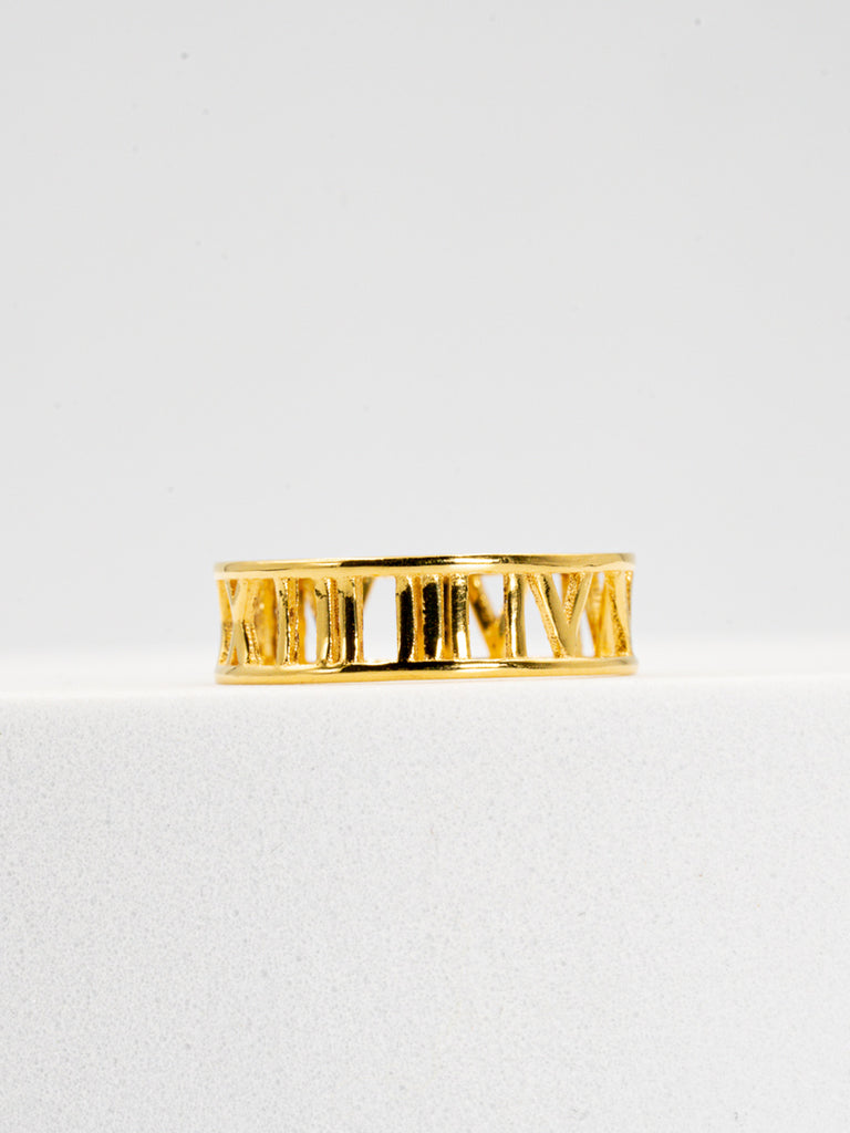 Gold roman ring on flat placement